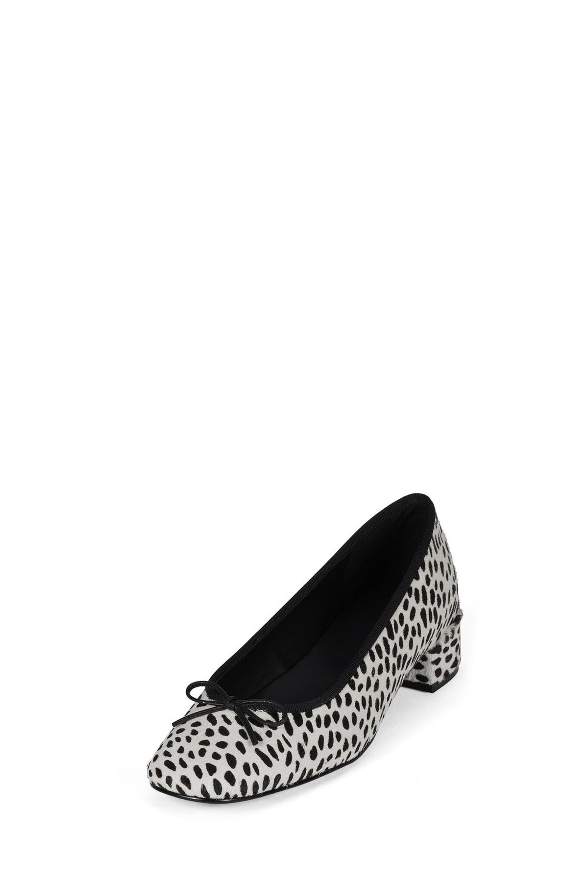 Black and white spotted pump with a rounded toe low block heel black trim and delicate lace detail across the vamp